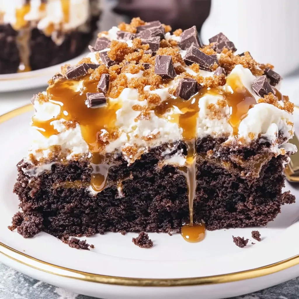 A slice of chocolate cake with caramel drizzle.