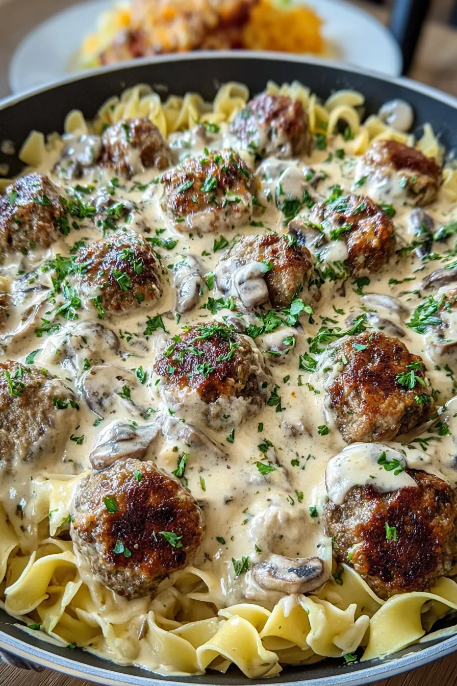 A plate of food with meatballs and noodles.